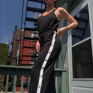 Black jumpsuit with snap legs